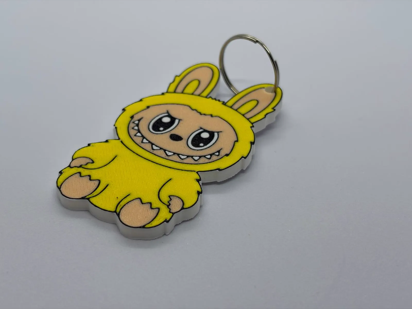 Portachiavi Labubu giallo stampato in 3D - Apritisesamo Ticino